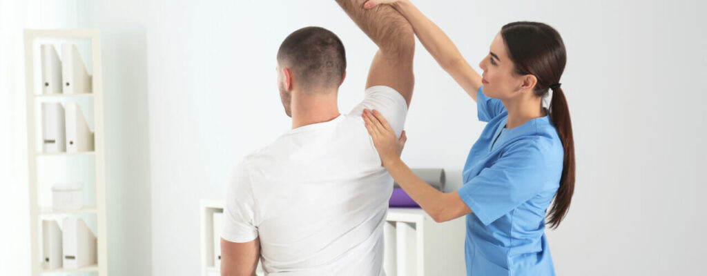 A man undergoing physical therapy treatment for natural pain relief